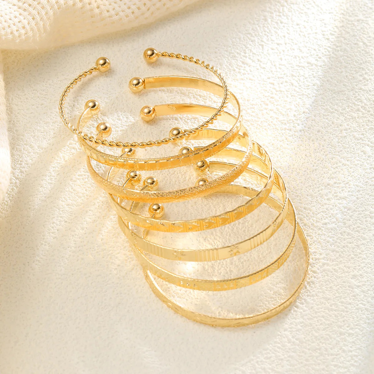 7 BRAZALETES ORO Y PLATA