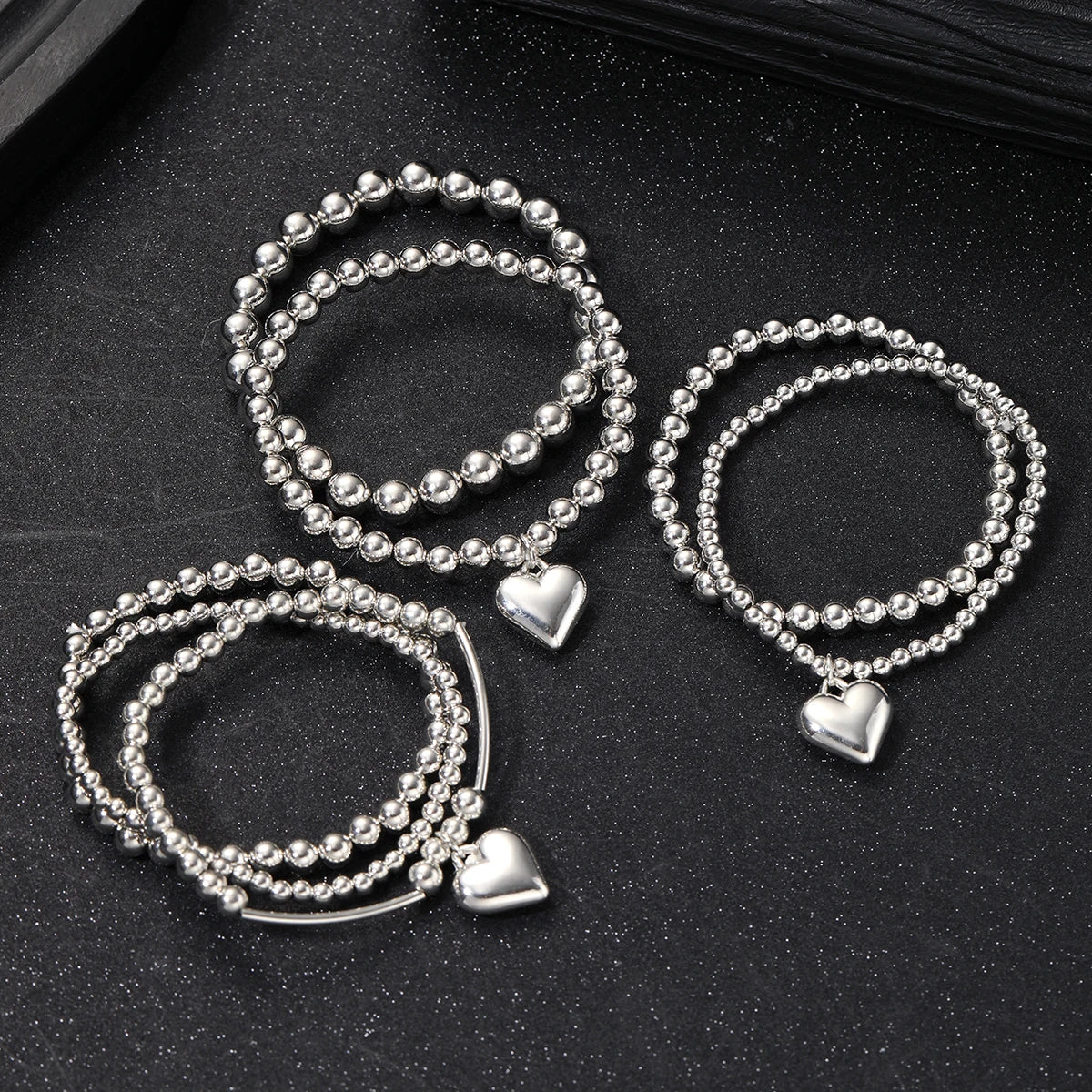 7 PULSERAS BOHOEMIAS CON CORAZÓN DE PLATA