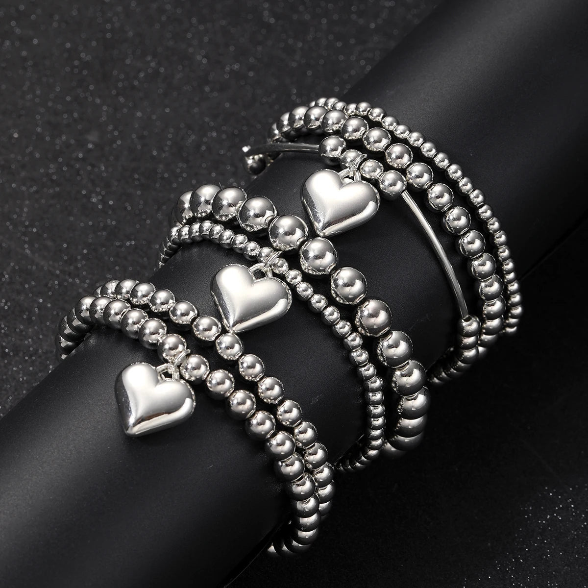 7 PULSERAS BOHOEMIAS CON CORAZÓN DE PLATA