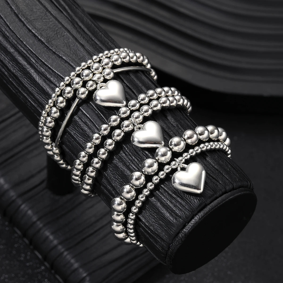 7 PULSERAS BOHOEMIAS CON CORAZÓN DE PLATA