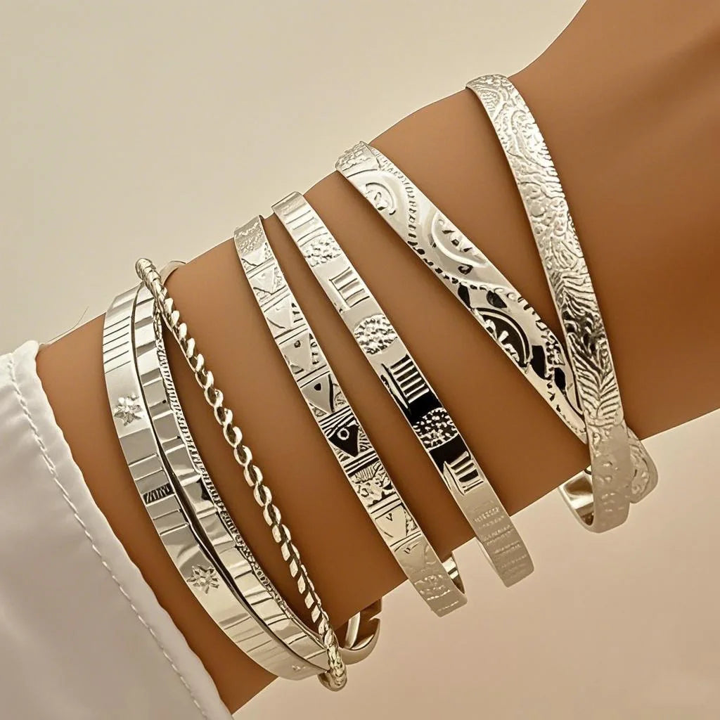 7 BRAZALETES ORO Y PLATA
